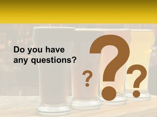 A Row Of Beer Glasses Sitting On Top Of A Wooden Table PowerPoint Template