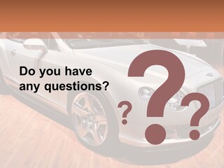 A White Car Is On Display In A Showroom PowerPoint Template