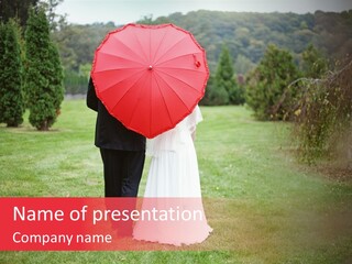 A Bride And Groom Holding A Red Umbrella PowerPoint Template