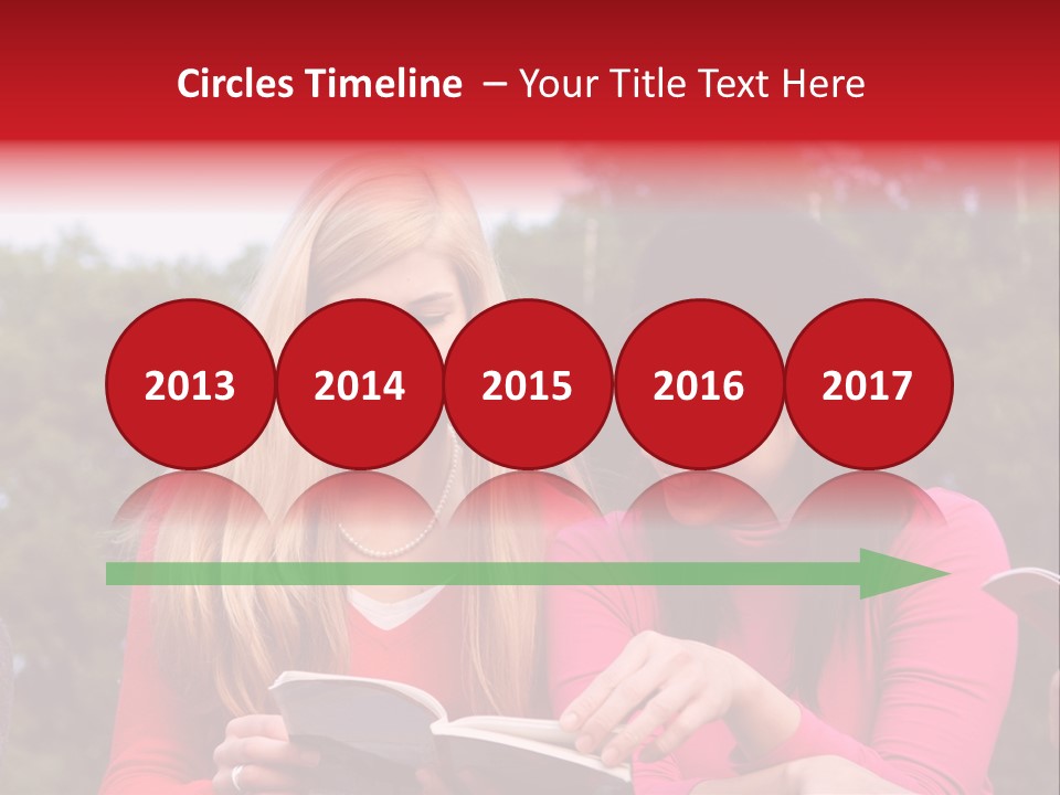 Two Women Are Looking At A Book Together PowerPoint Template