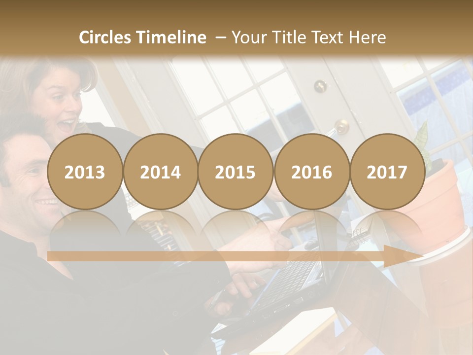 A Man And A Woman Looking At A Laptop Screen PowerPoint Template