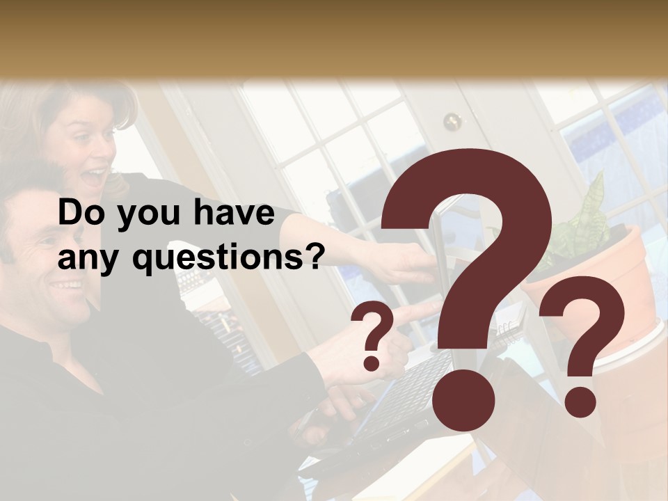 A Man And A Woman Looking At A Laptop Screen PowerPoint Template