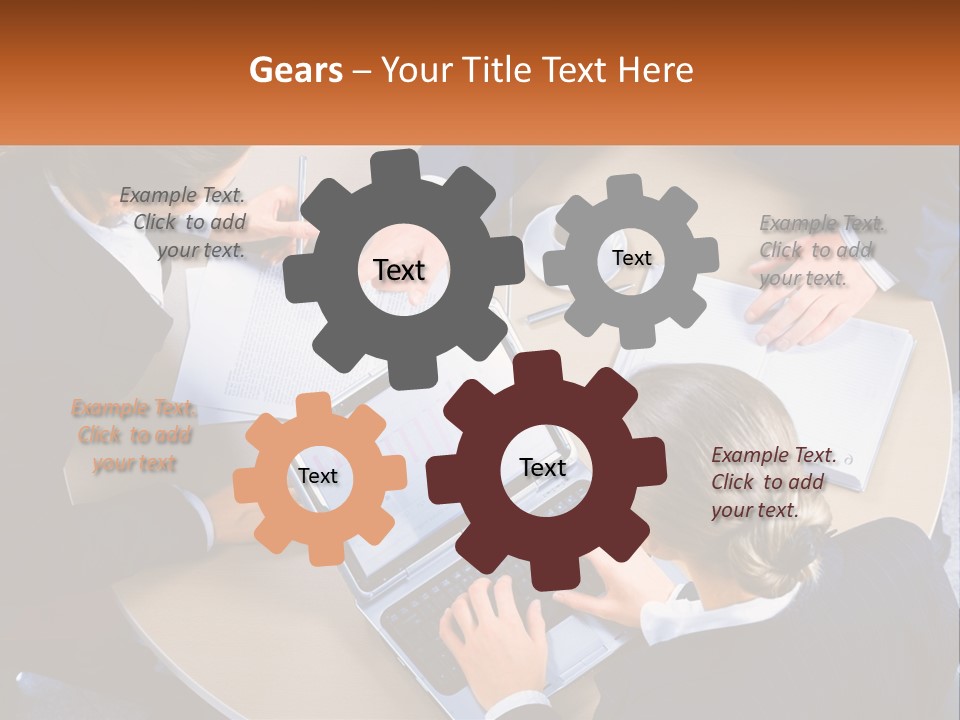 A Group Of People Sitting At A Table Working On Laptops PowerPoint Template