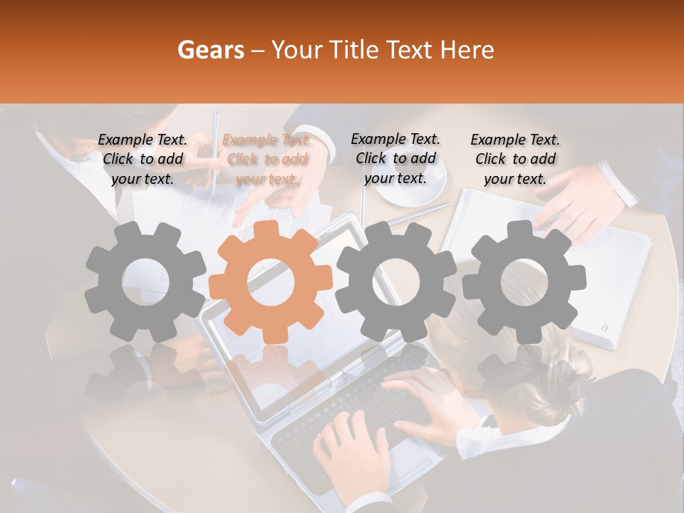 A Group Of People Sitting At A Table Working On Laptops PowerPoint Template