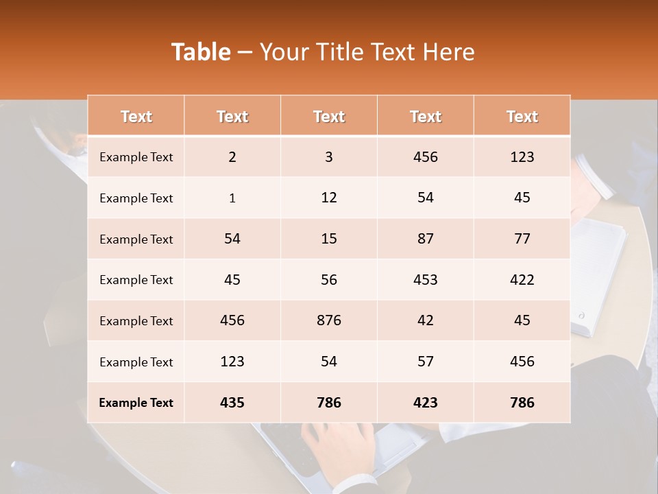 A Group Of People Sitting At A Table Working On Laptops PowerPoint Template