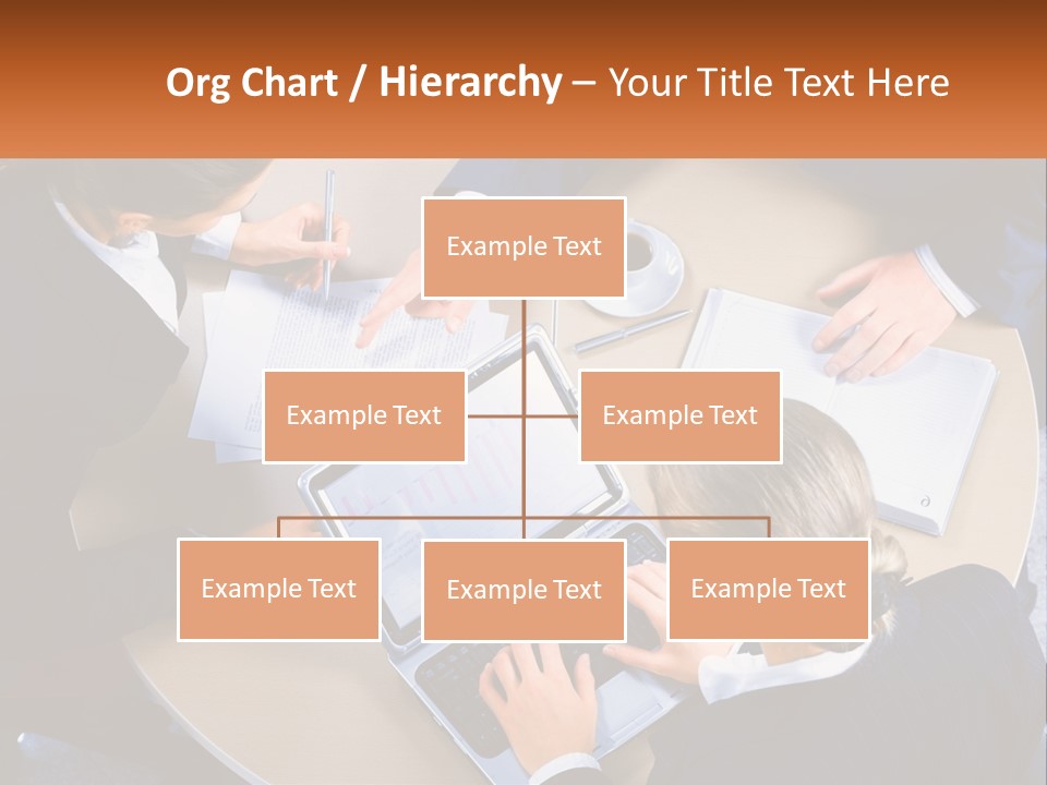 A Group Of People Sitting At A Table Working On Laptops PowerPoint Template