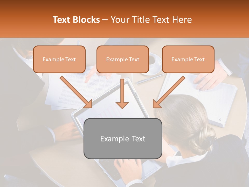 A Group Of People Sitting At A Table Working On Laptops PowerPoint Template