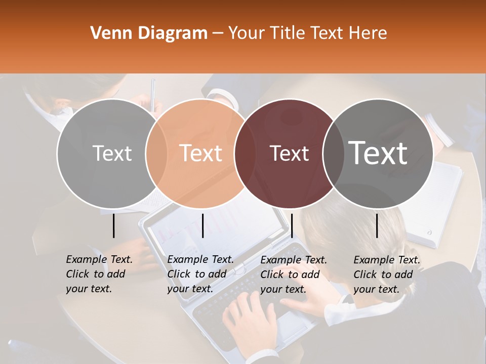 A Group Of People Sitting At A Table Working On Laptops PowerPoint Template