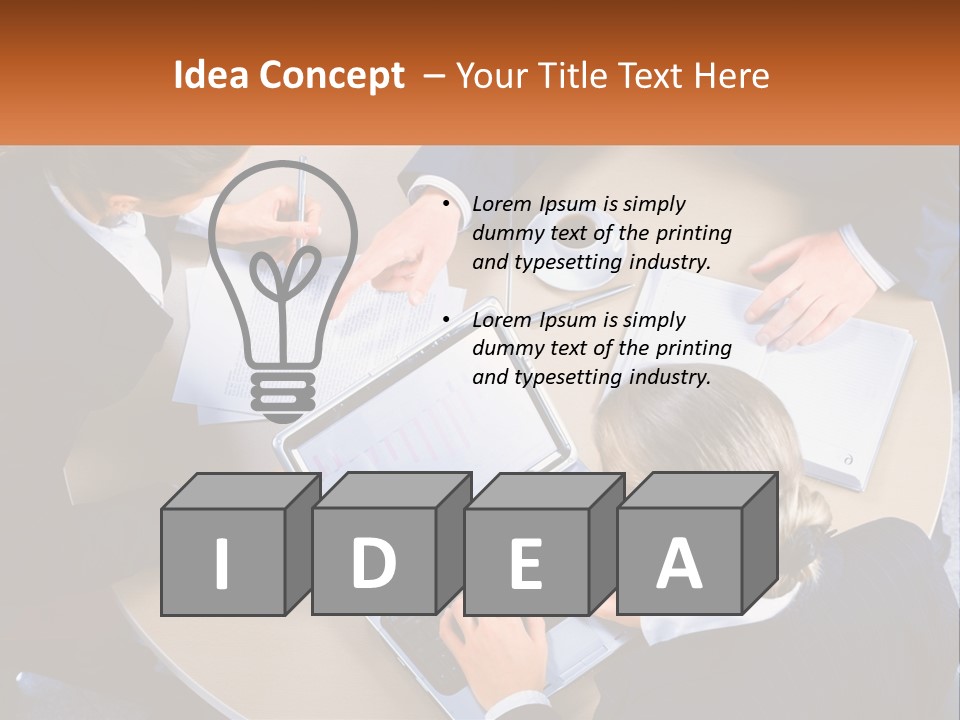 A Group Of People Sitting At A Table Working On Laptops PowerPoint Template