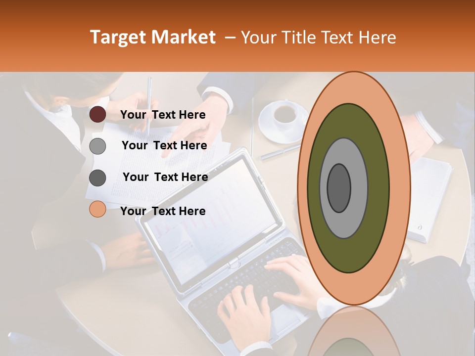 A Group Of People Sitting At A Table Working On Laptops PowerPoint Template