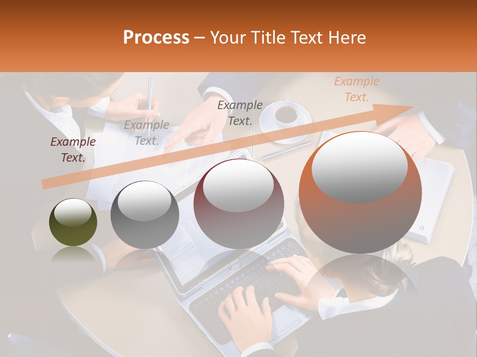 A Group Of People Sitting At A Table Working On Laptops PowerPoint Template