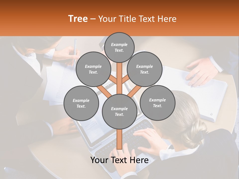 A Group Of People Sitting At A Table Working On Laptops PowerPoint Template