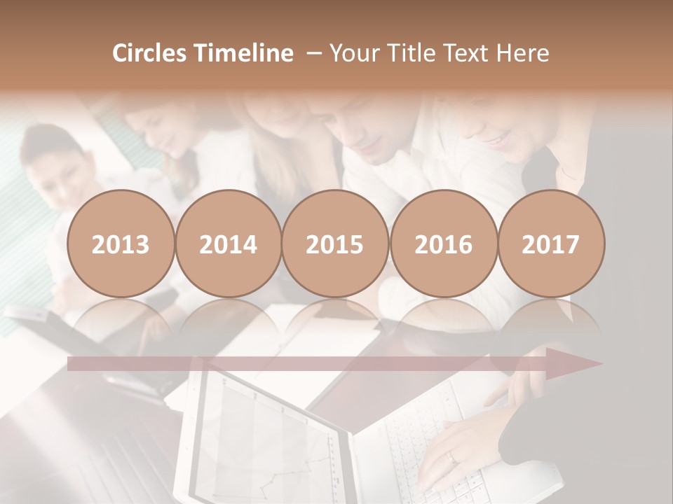 A Group Of People Sitting At A Table With Laptops PowerPoint Template