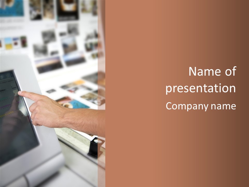 A Person Pointing At A Computer Screen On A Desk PowerPoint Template