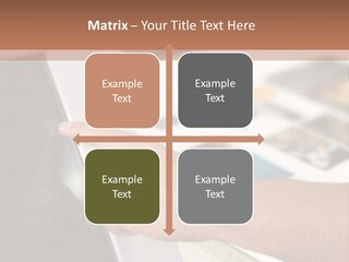 A Person Pointing At A Computer Screen On A Desk PowerPoint Template