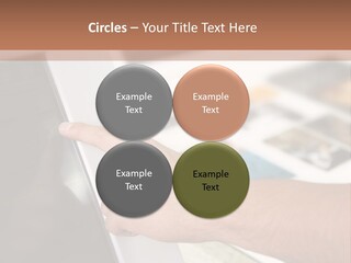 A Person Pointing At A Computer Screen On A Desk PowerPoint Template