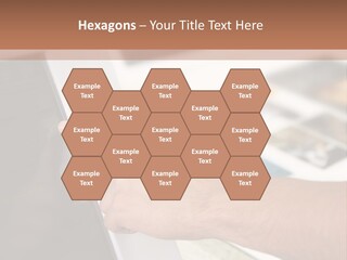 A Person Pointing At A Computer Screen On A Desk PowerPoint Template