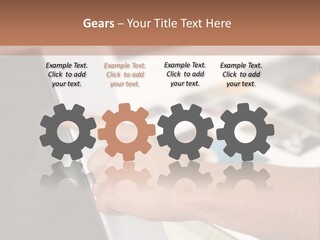 A Person Pointing At A Computer Screen On A Desk PowerPoint Template