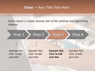 A Person Pointing At A Computer Screen On A Desk PowerPoint Template