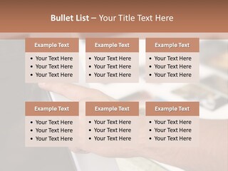 A Person Pointing At A Computer Screen On A Desk PowerPoint Template