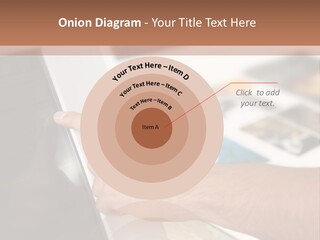 A Person Pointing At A Computer Screen On A Desk PowerPoint Template