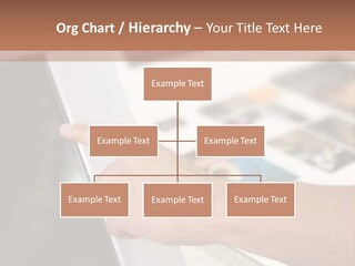 A Person Pointing At A Computer Screen On A Desk PowerPoint Template