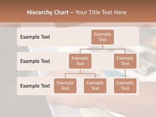 A Person Pointing At A Computer Screen On A Desk PowerPoint Template