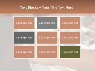 A Person Pointing At A Computer Screen On A Desk PowerPoint Template