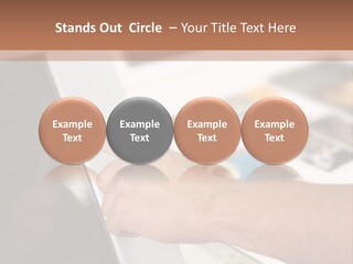 A Person Pointing At A Computer Screen On A Desk PowerPoint Template