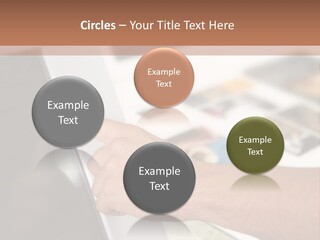 A Person Pointing At A Computer Screen On A Desk PowerPoint Template