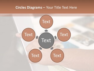 A Person Pointing At A Computer Screen On A Desk PowerPoint Template