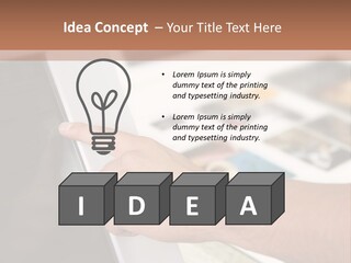 A Person Pointing At A Computer Screen On A Desk PowerPoint Template