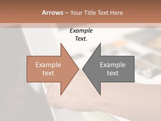 A Person Pointing At A Computer Screen On A Desk PowerPoint Template