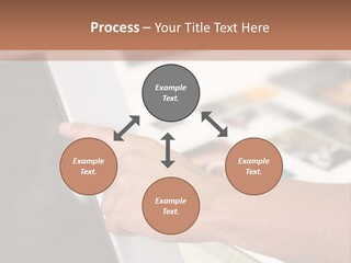 A Person Pointing At A Computer Screen On A Desk PowerPoint Template