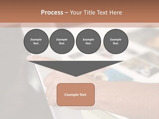 A Person Pointing At A Computer Screen On A Desk PowerPoint Template