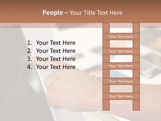 A Person Pointing At A Computer Screen On A Desk PowerPoint Template