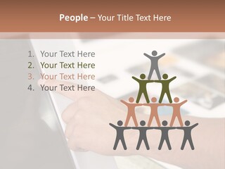 A Person Pointing At A Computer Screen On A Desk PowerPoint Template