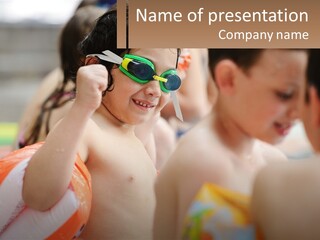 A Group Of Young Children Wearing Swimming Goggles PowerPoint Template