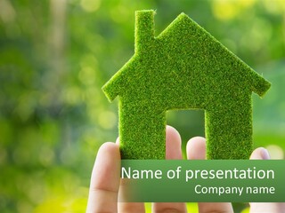 A Person Holding A Small Green House In Their Hands PowerPoint Template