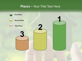A Person Holding A Small Green House In Their Hands PowerPoint Template