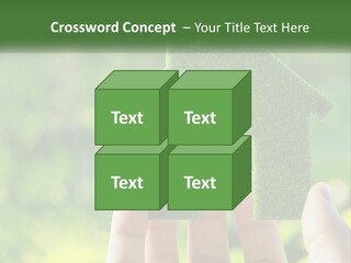 A Person Holding A Small Green House In Their Hands PowerPoint Template