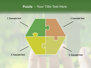 A Person Holding A Small Green House In Their Hands PowerPoint Template