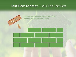 A Person Holding A Small Green House In Their Hands PowerPoint Template