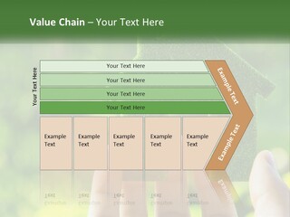 A Person Holding A Small Green House In Their Hands PowerPoint Template