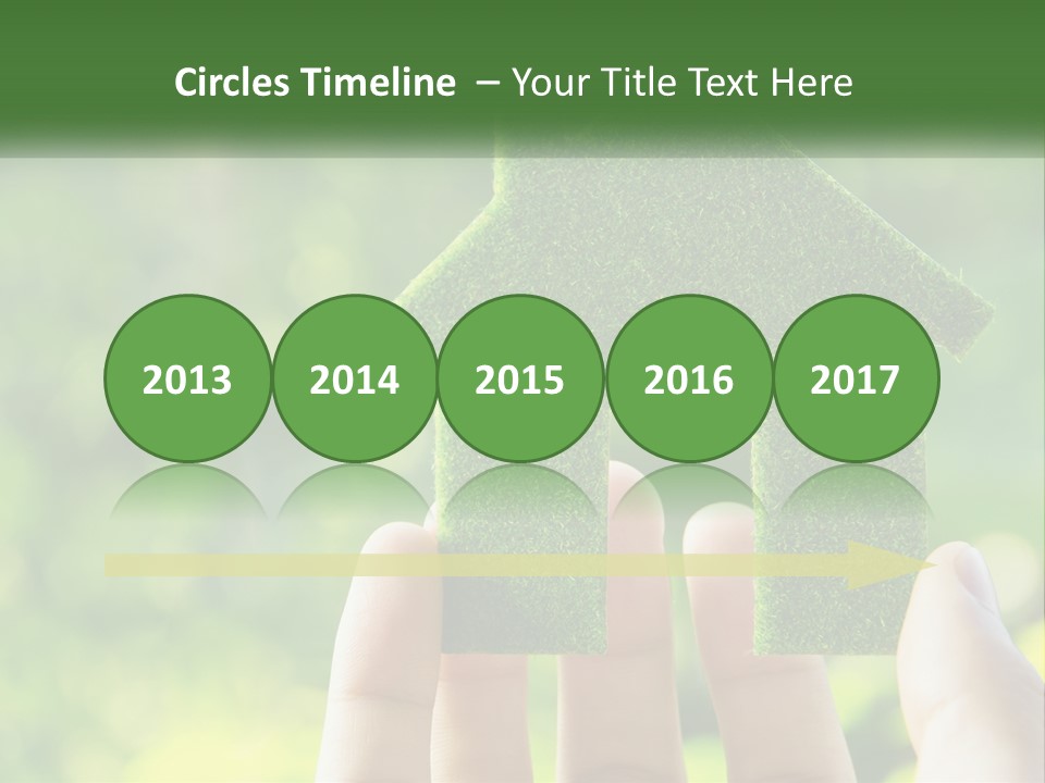 A Person Holding A Small Green House In Their Hands PowerPoint Template