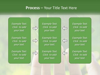 A Person Holding A Small Green House In Their Hands PowerPoint Template