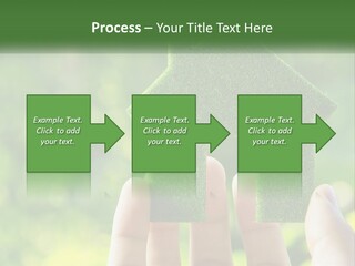 A Person Holding A Small Green House In Their Hands PowerPoint Template