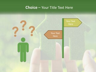 A Person Holding A Small Green House In Their Hands PowerPoint Template