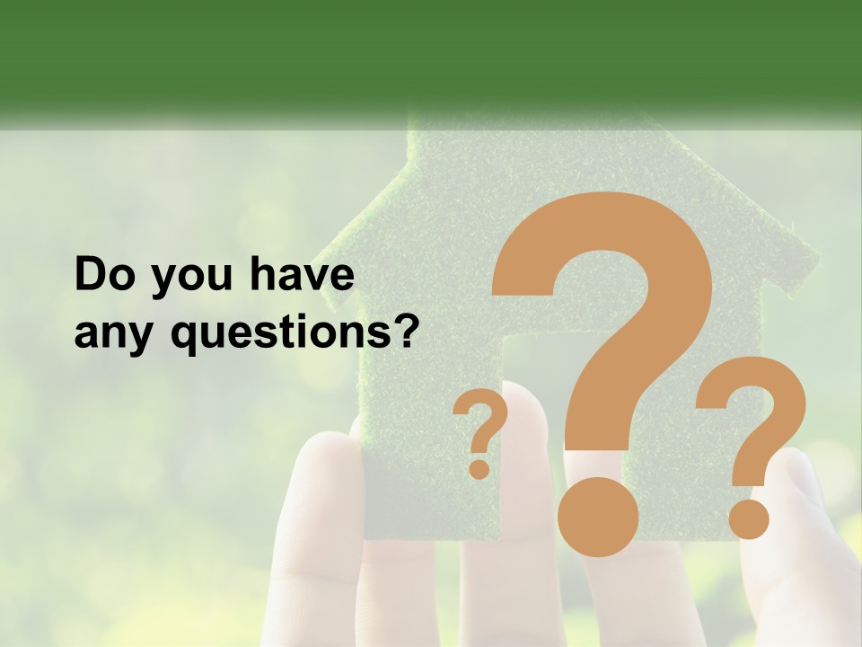 A Person Holding A Small Green House In Their Hands PowerPoint Template