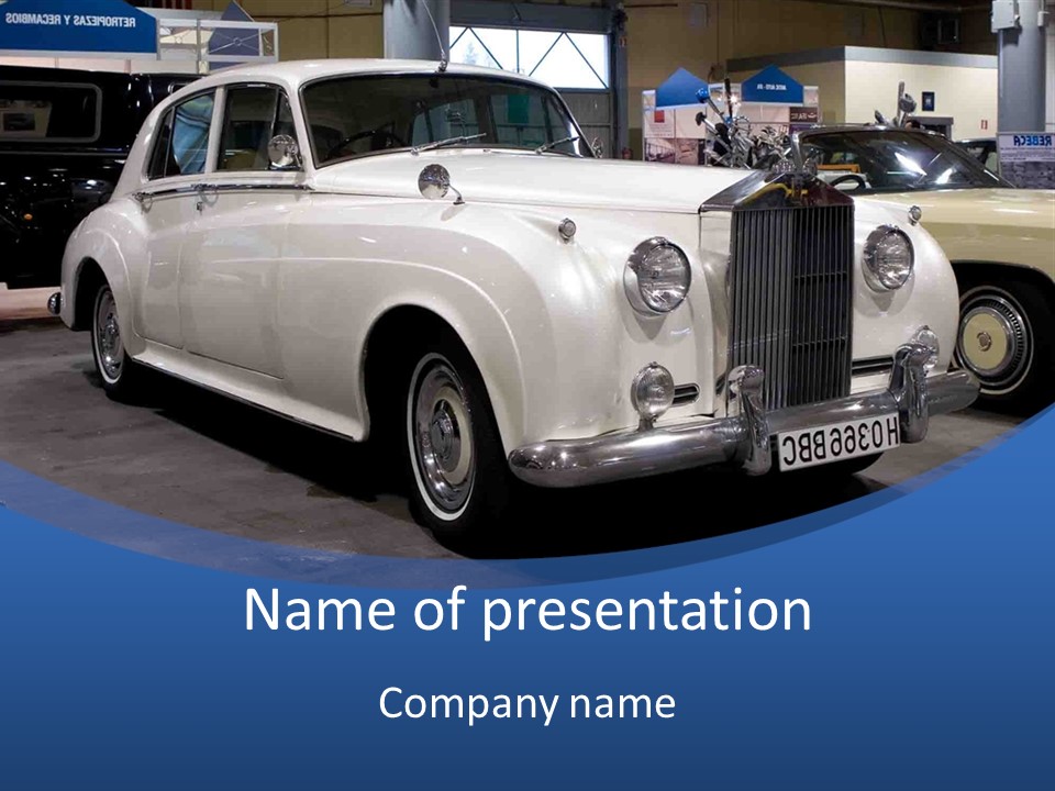 A White Car Is On Display In A Showroom PowerPoint Template